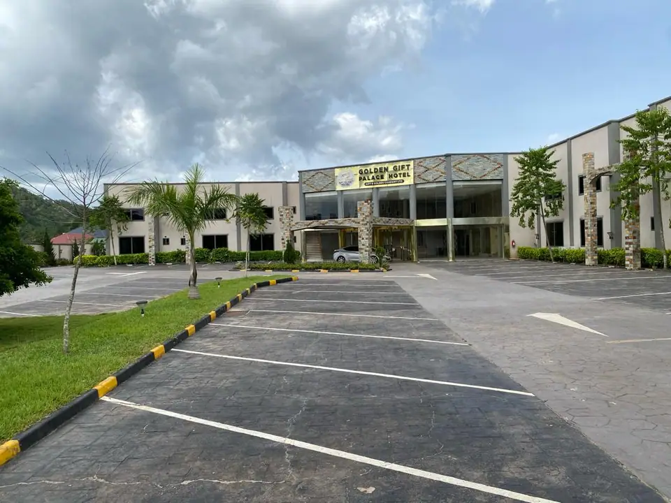 Golden Gift Palace Hotel main building seen across the forecourt
