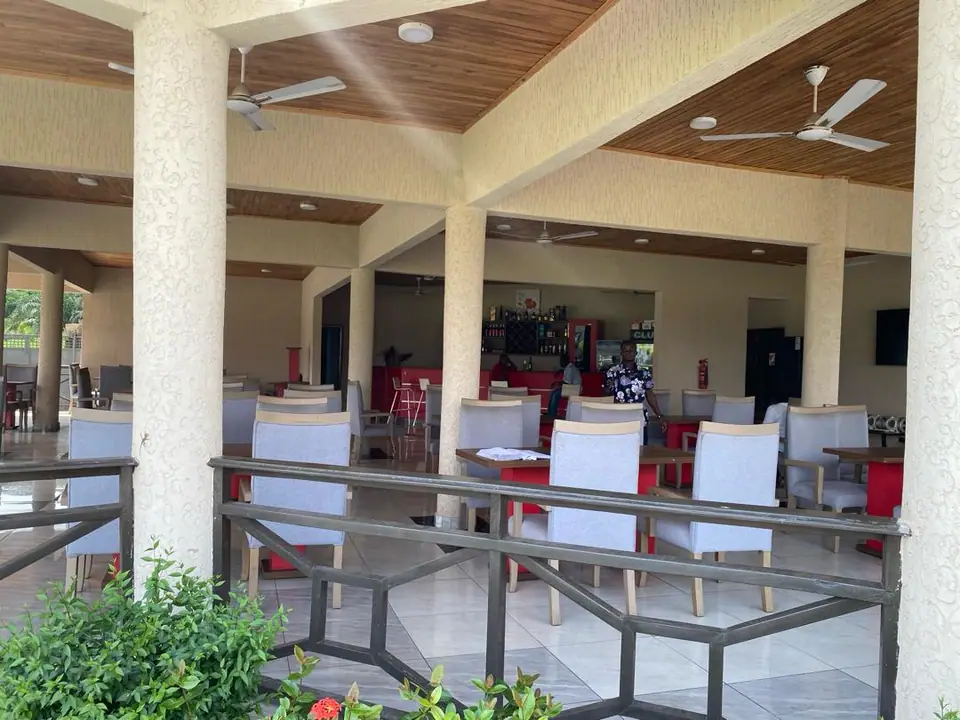 Restaurant terrace with ceiling fans and garden planting