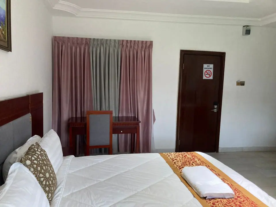 Deluxe room bed with gold runner