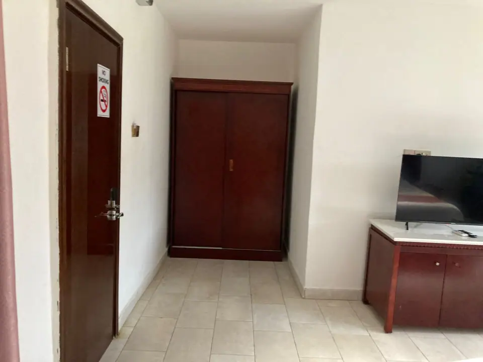 Entrance and wardrobe of a Deluxe room