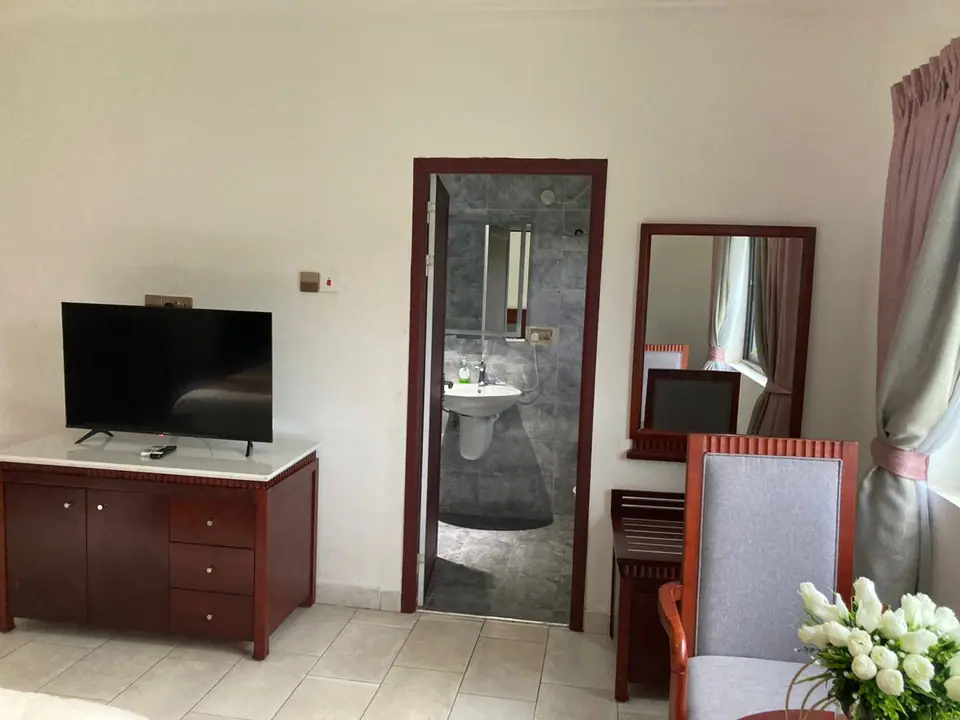 Deluxe room desk area with en-suite bathroom