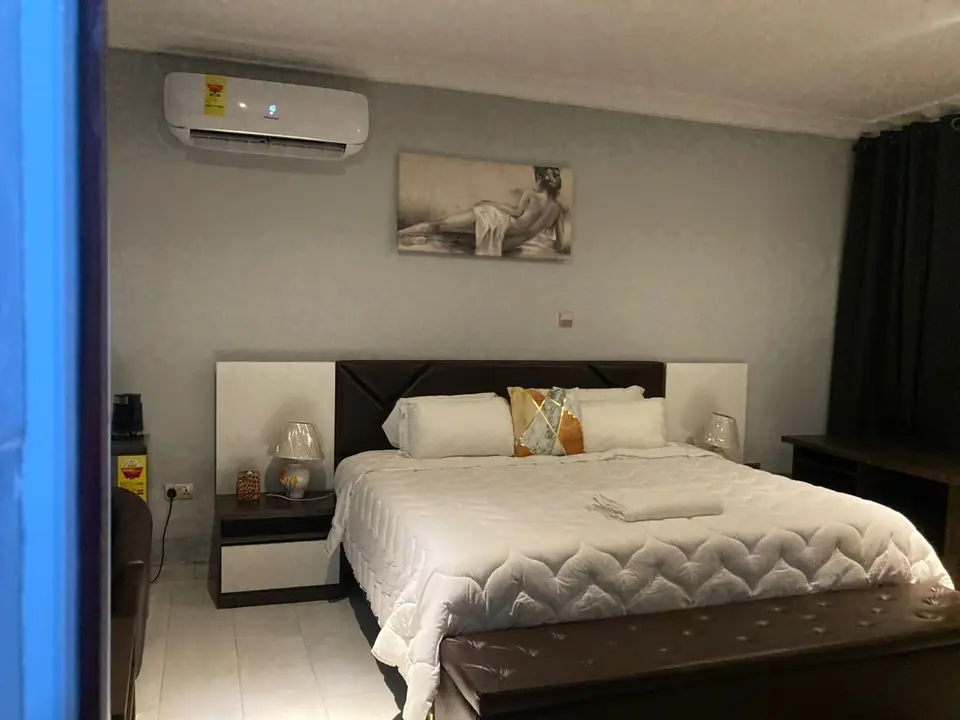 Superior Room with a double bed and wall art