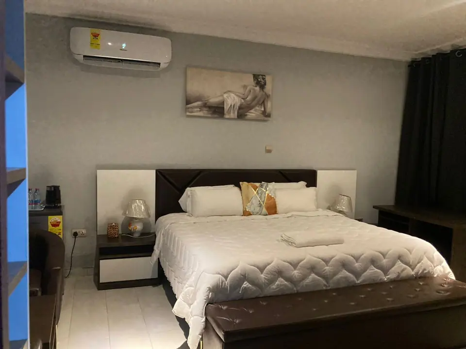 Bed and bedside table in a Superior Room